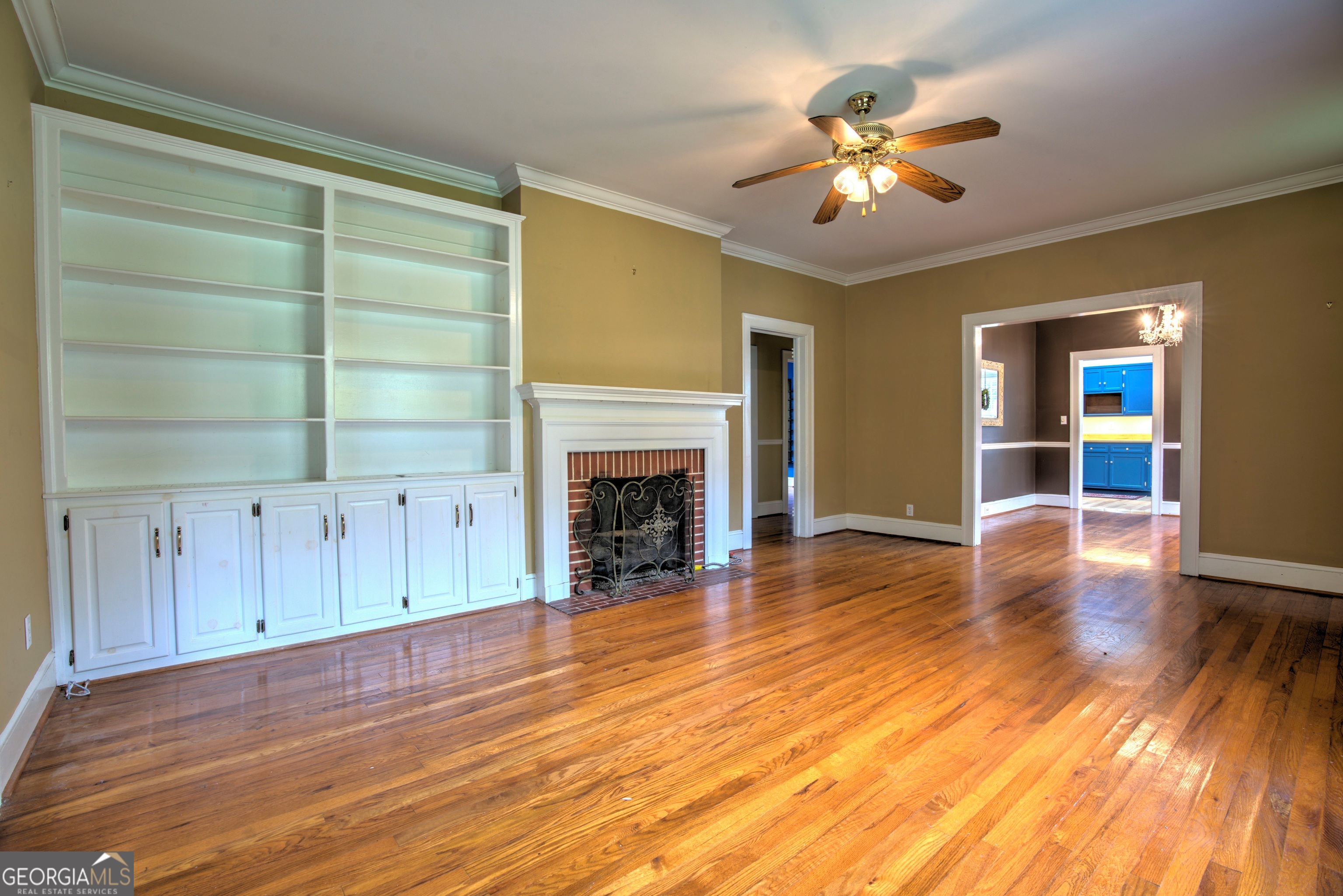 19 Berckmans Lane Southwest Rome, GA 30165 - Photo 4 of 26 a view of an empty room with wooden floor and a fireplace
