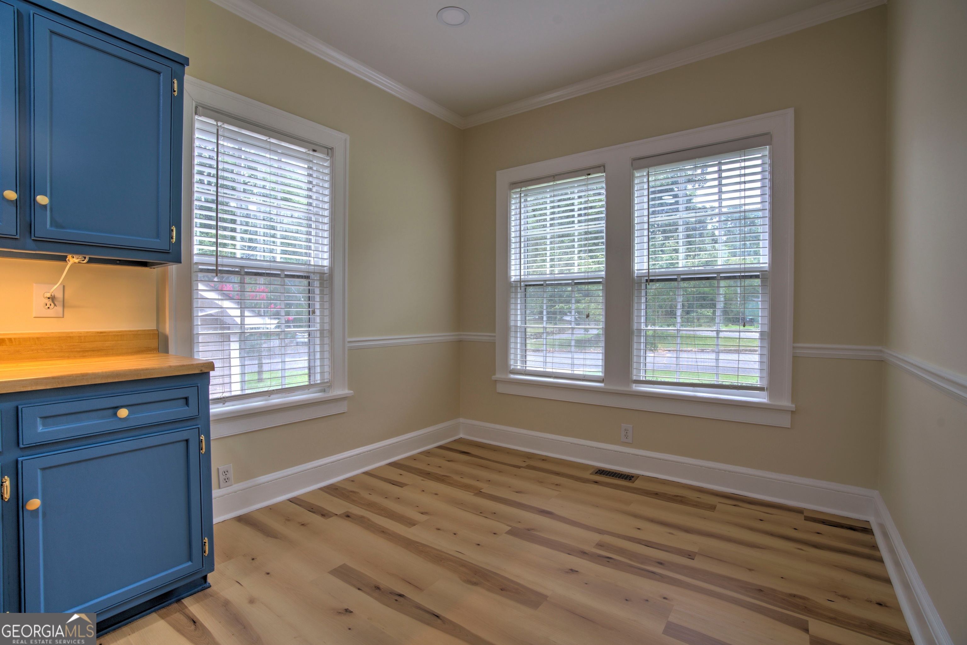 19 Berckmans Lane Southwest Rome, GA 30165 - Photo 7 of 26 a view of an empty room with wooden floor and a window