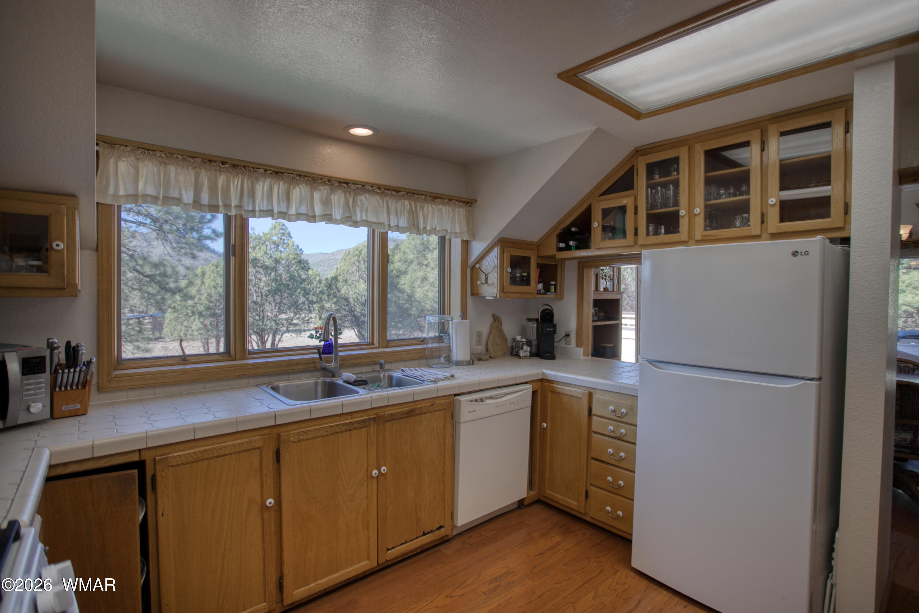 19 County Road Show Low, AZ 85901 - Photo 9 of 43 a kitchen with a sink a refrigerator and window