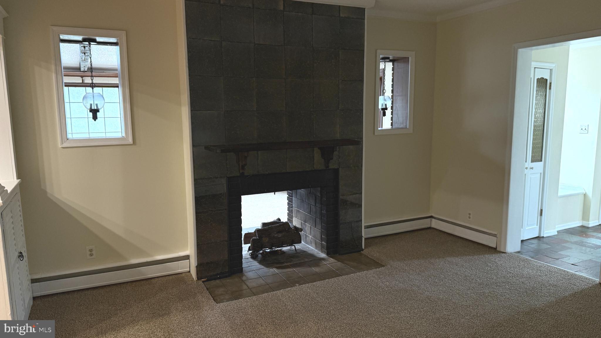 328 Hutchinson Terrace, Unit A Holmes, PA 19043 - Photo 12 of 27 an empty room with windows