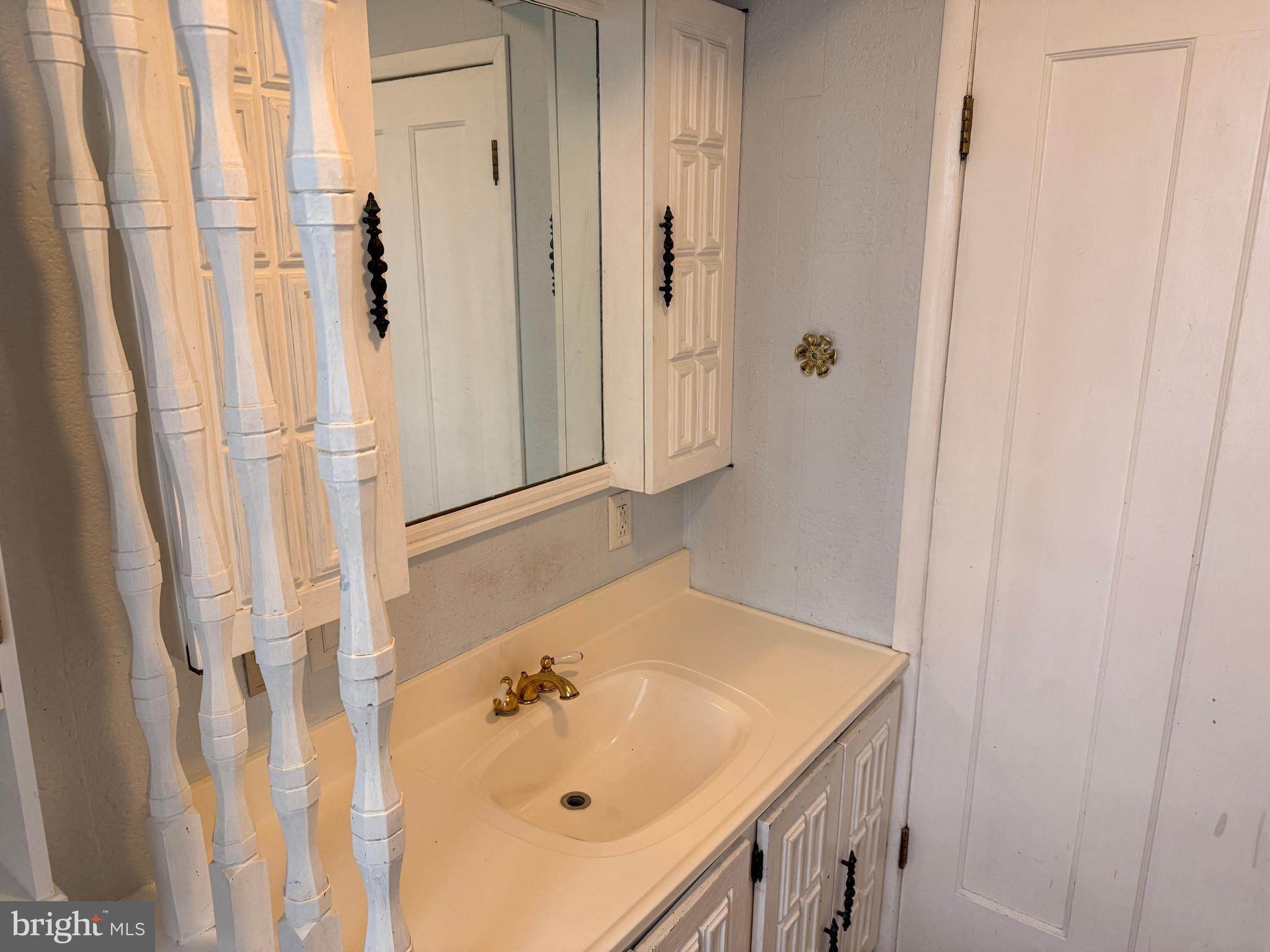 328 Hutchinson Terrace, Unit A Holmes, PA 19043 - Photo 17 of 27 a bathroom with a sink and vanity