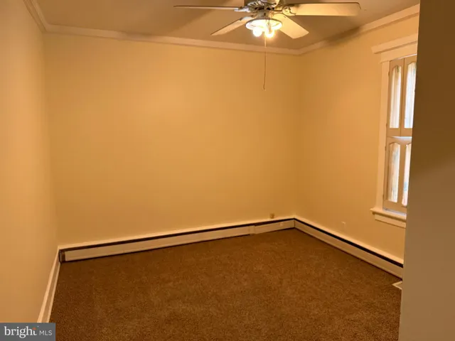 a view of a room with wooden door