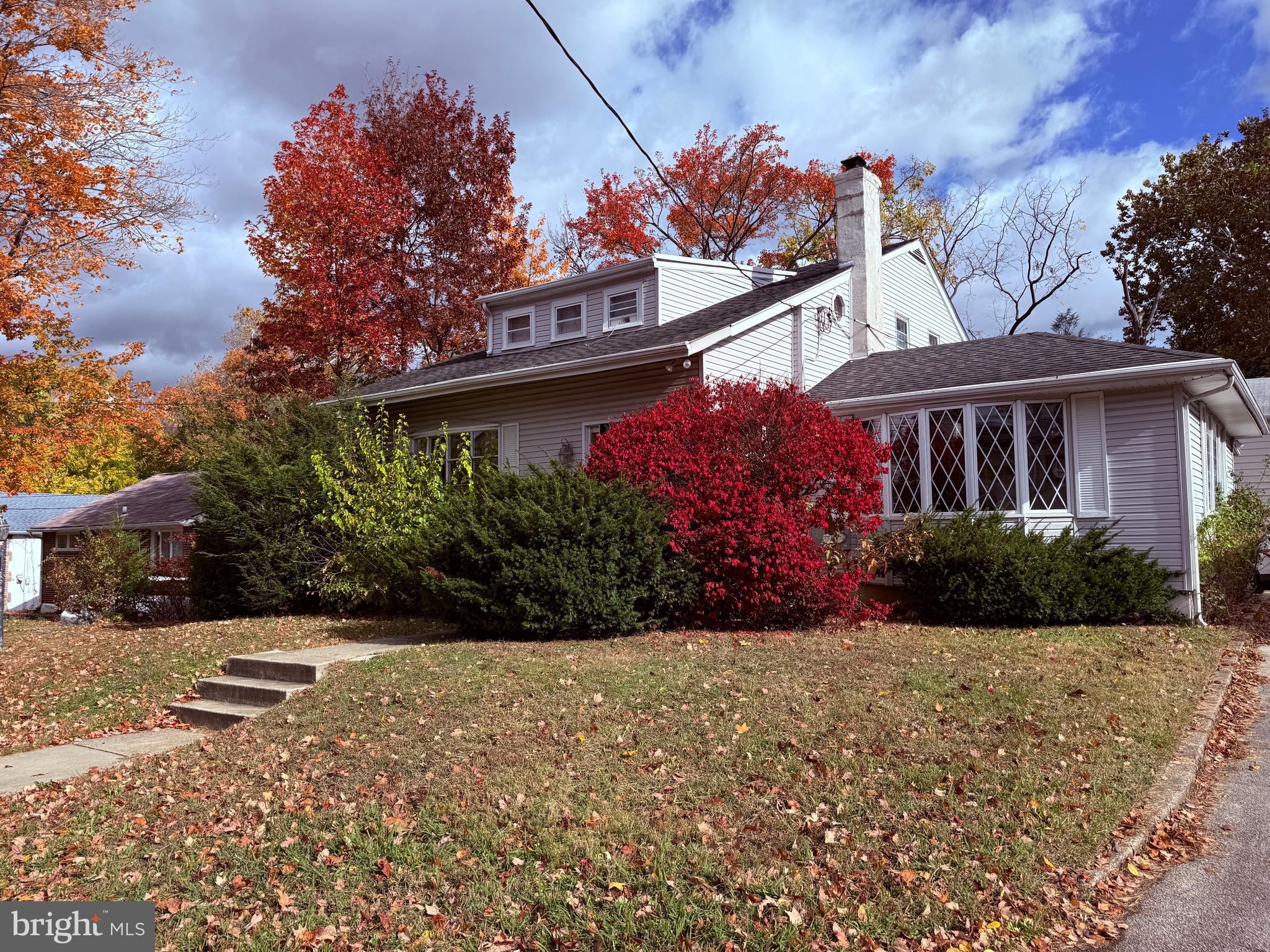 328 Hutchinson Terrace, Unit A Holmes, PA 19043 - Photo 2 of 27 a view of a house with a yard and potted plants