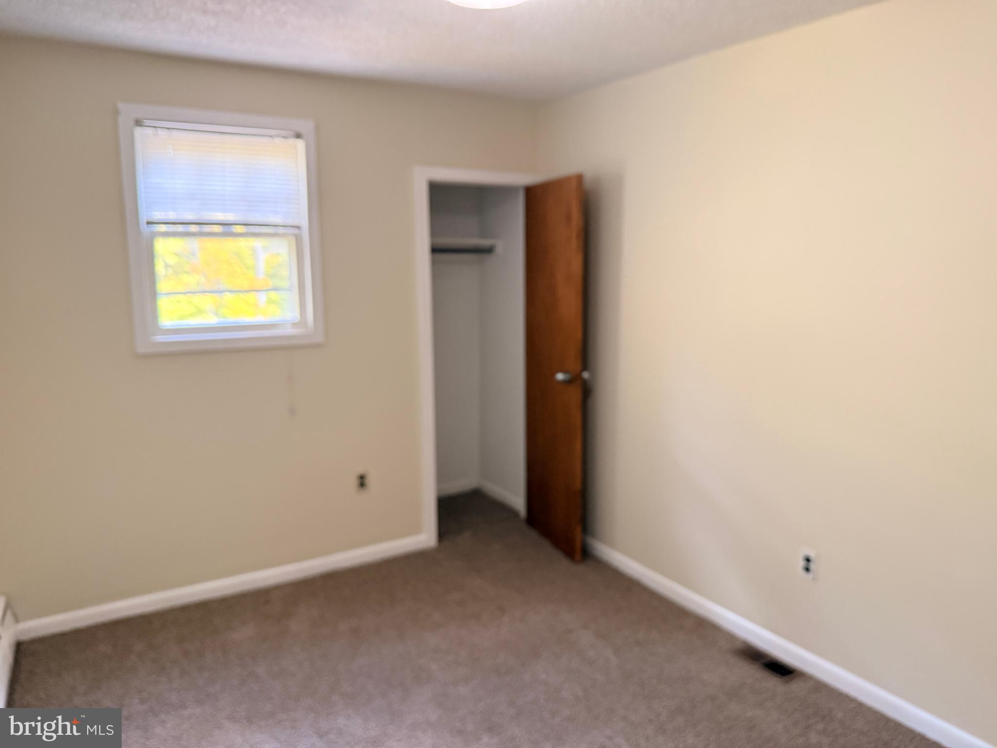 328 Hutchinson Terrace, Unit A Holmes, PA 19043 - Photo 25 of 27 an empty room with windows