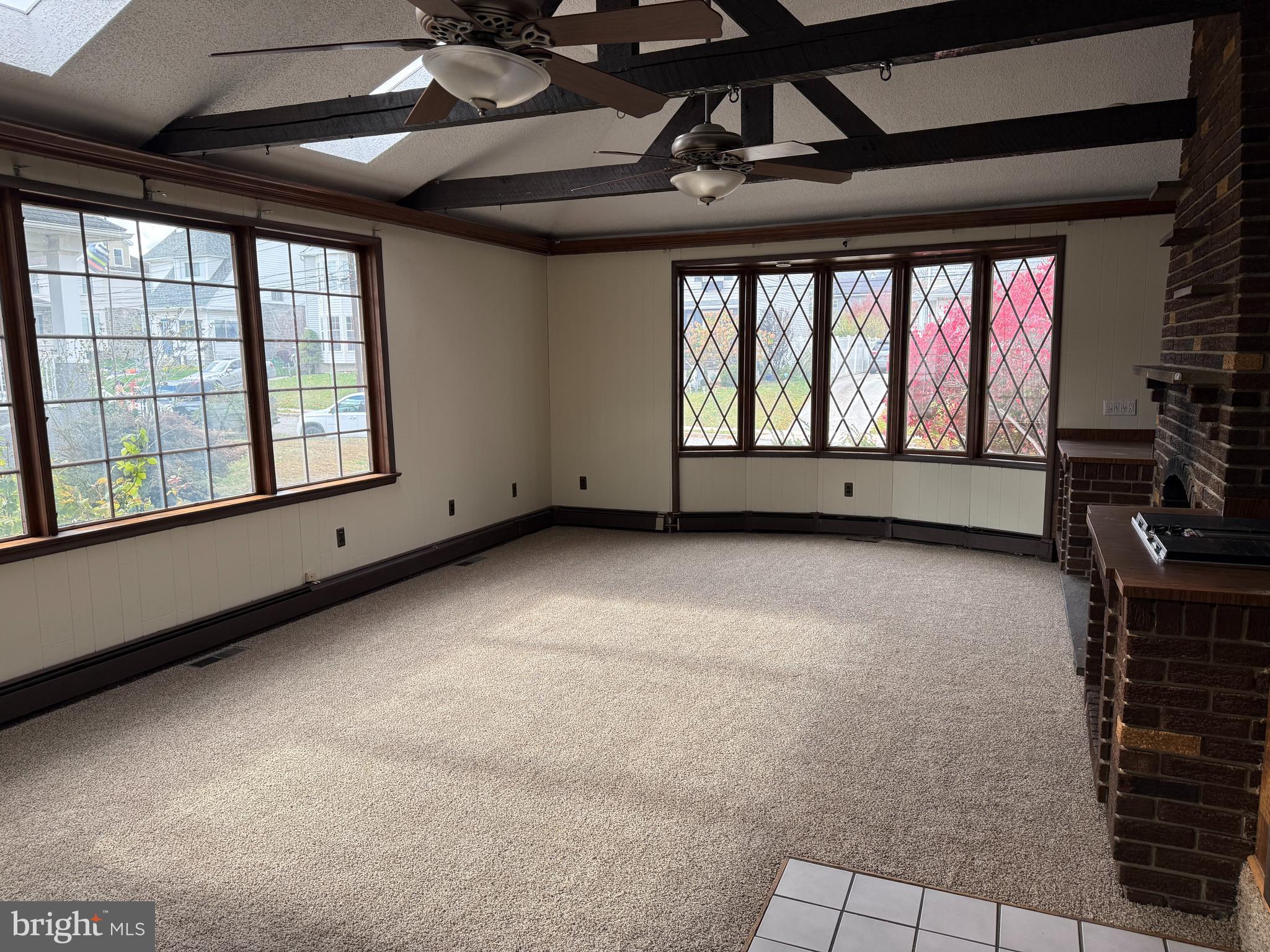 328 Hutchinson Terrace, Unit A Holmes, PA 19043 - Photo 3 of 27 a view of an empty room with a window