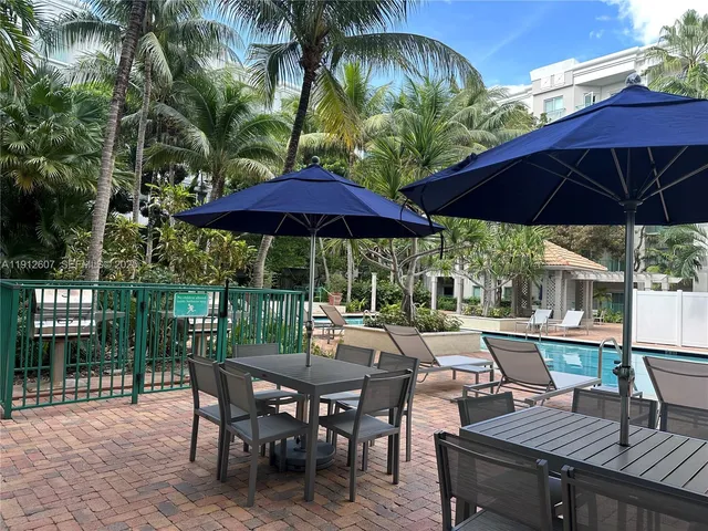 a view of backyard with seating space