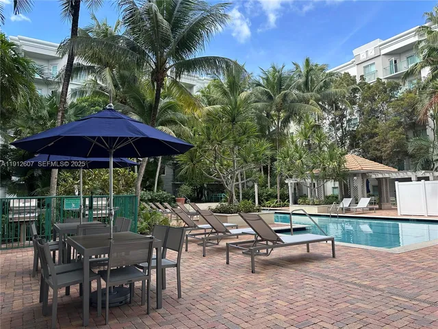 a view of a backyard with sitting area and furniture