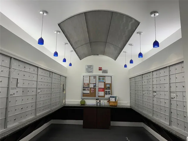 a room with lots of wooden cabinets and window