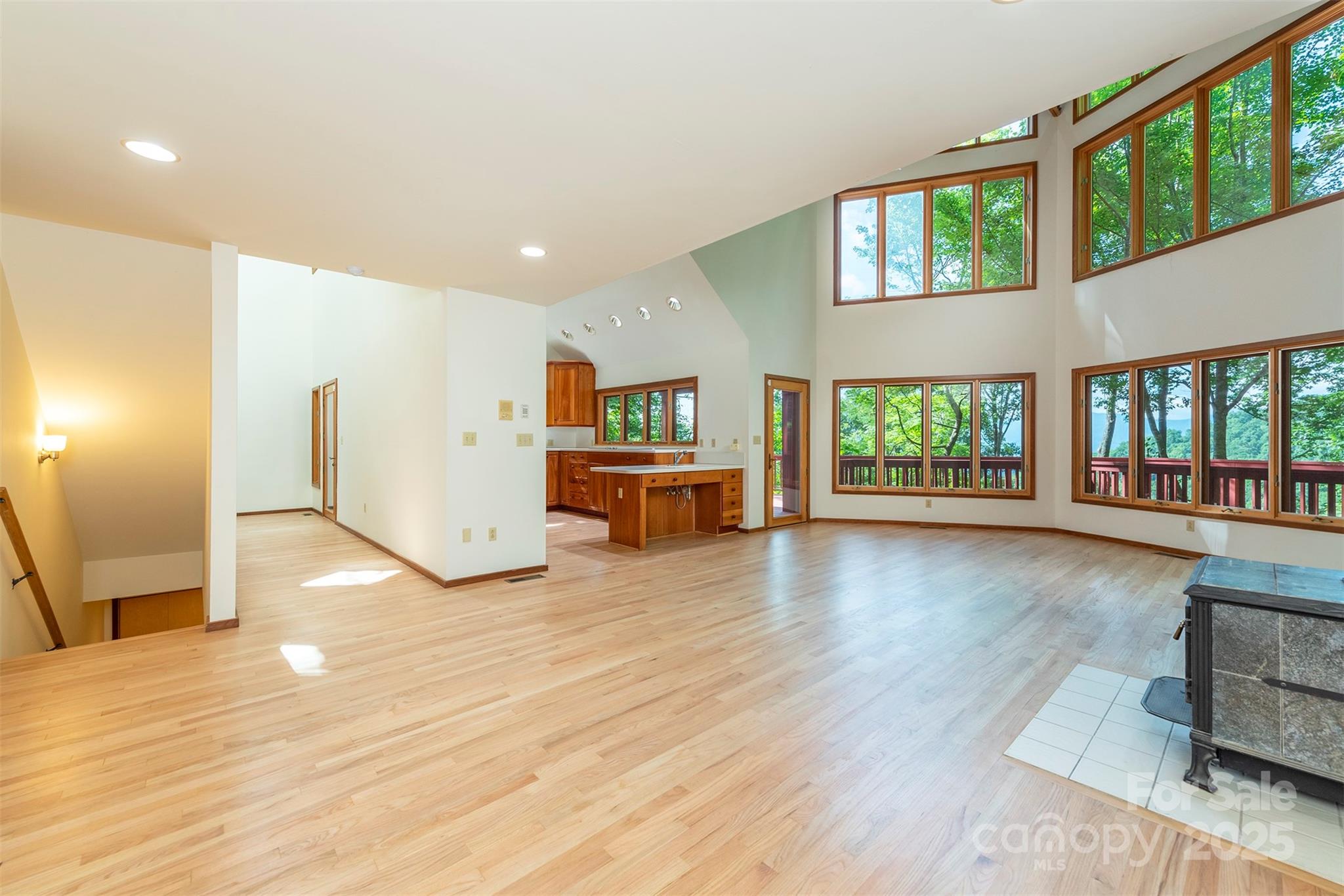7 Winding Poplar Road Black Mountain, NC 28711 - Photo 12 of 48 a view of a kitchen with furniture and floor to ceiling window