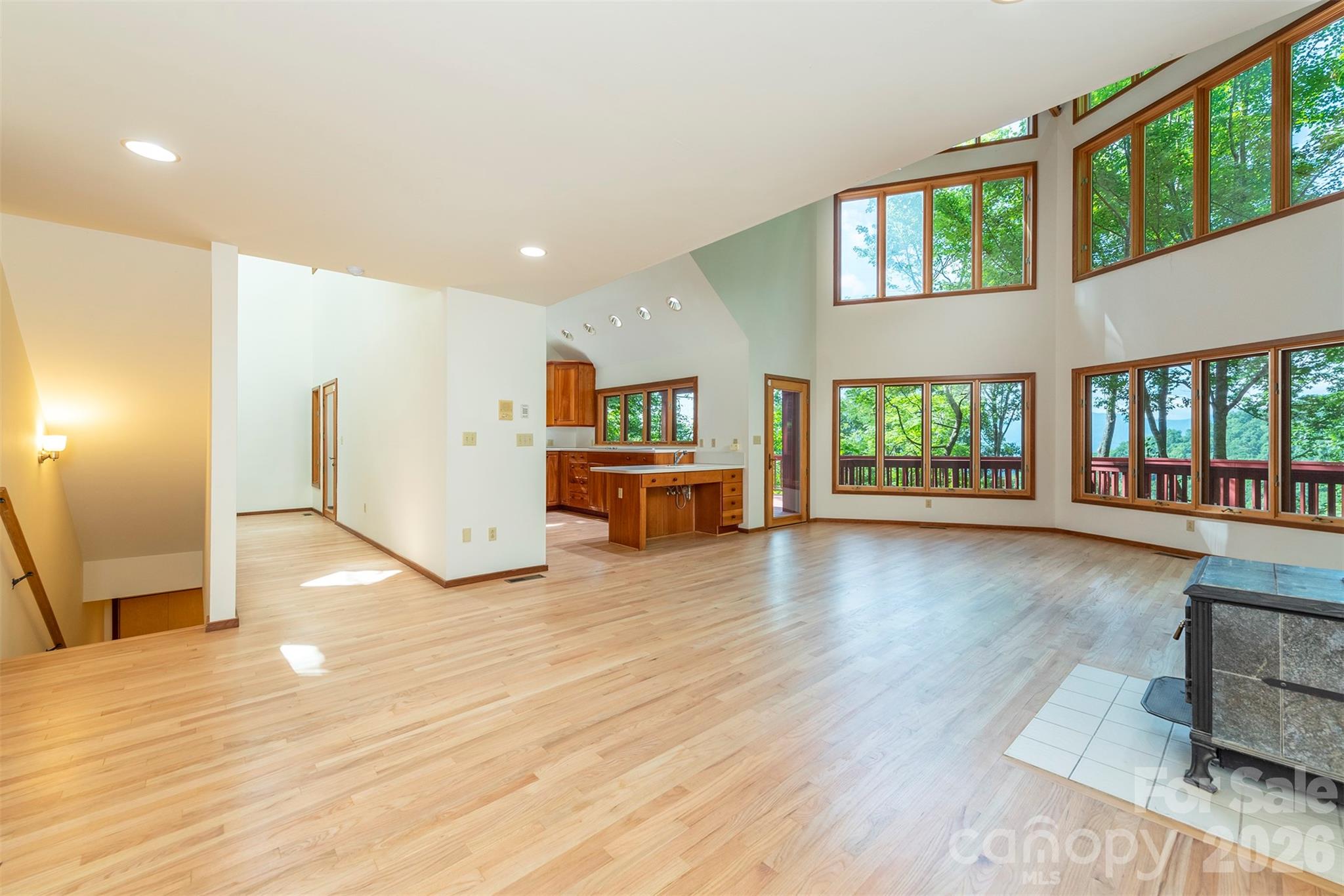 7 Winding Poplar Road Black Mountain, NC 28711 - Photo 12 of 48 a view of a kitchen with furniture and floor to ceiling window
