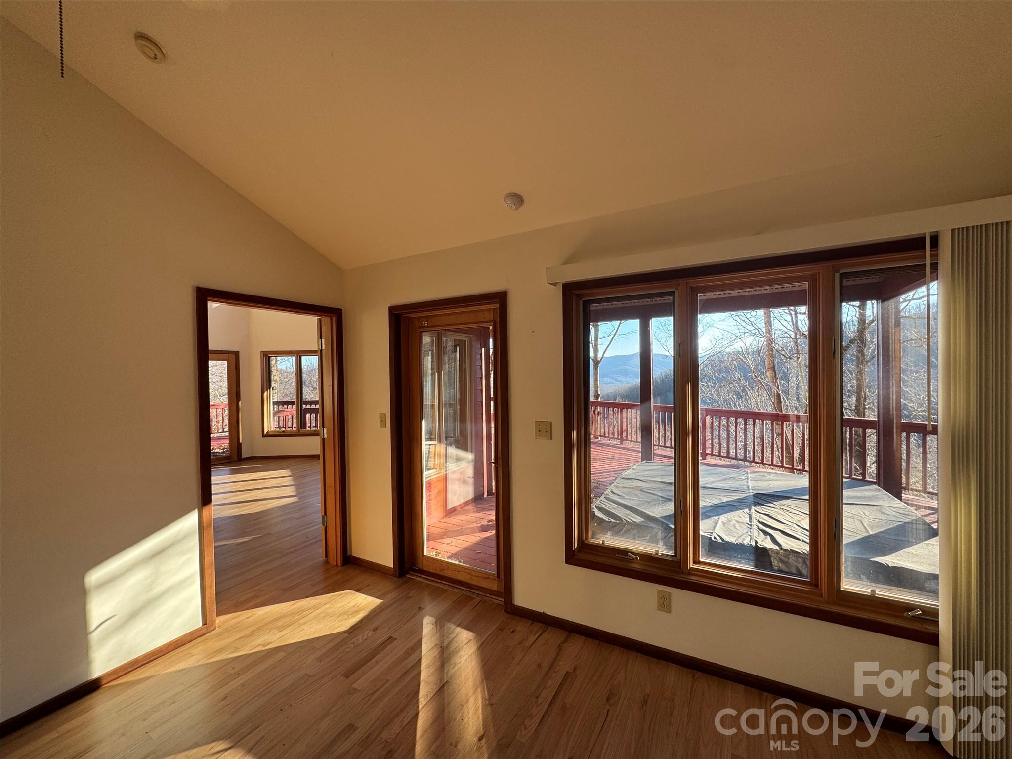 7 Winding Poplar Road Black Mountain, NC 28711 - Photo 18 of 48 a view of a big room with wooden floor and windows