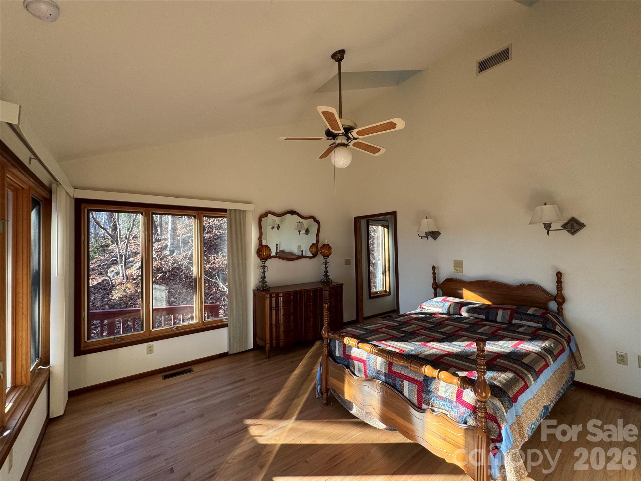 7 Winding Poplar Road Black Mountain, NC 28711 - Photo 19 of 48 a bedroom with a bed and wooden floor