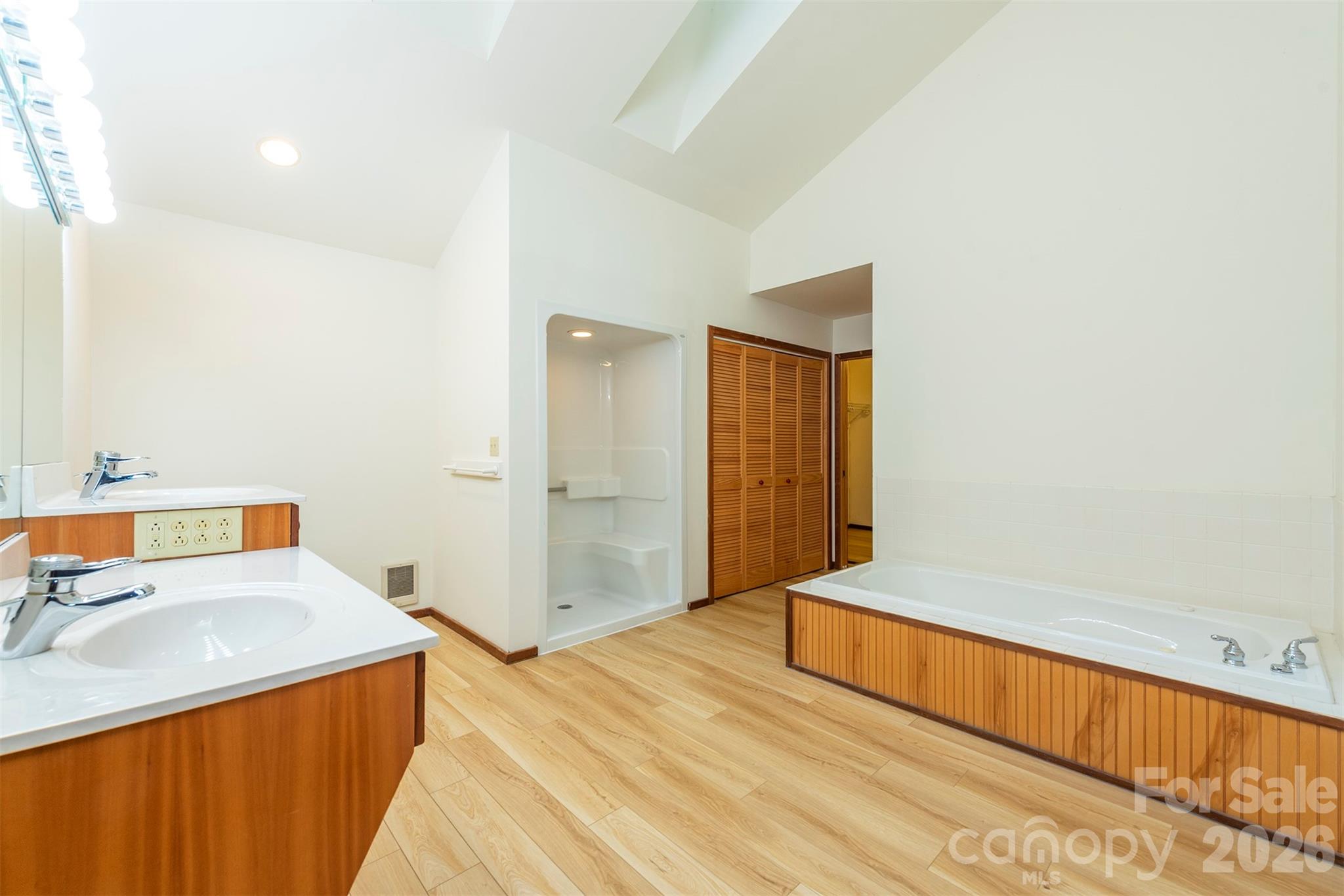 7 Winding Poplar Road Black Mountain, NC 28711 - Photo 20 of 48 a spacious bedroom with a bed and a sink