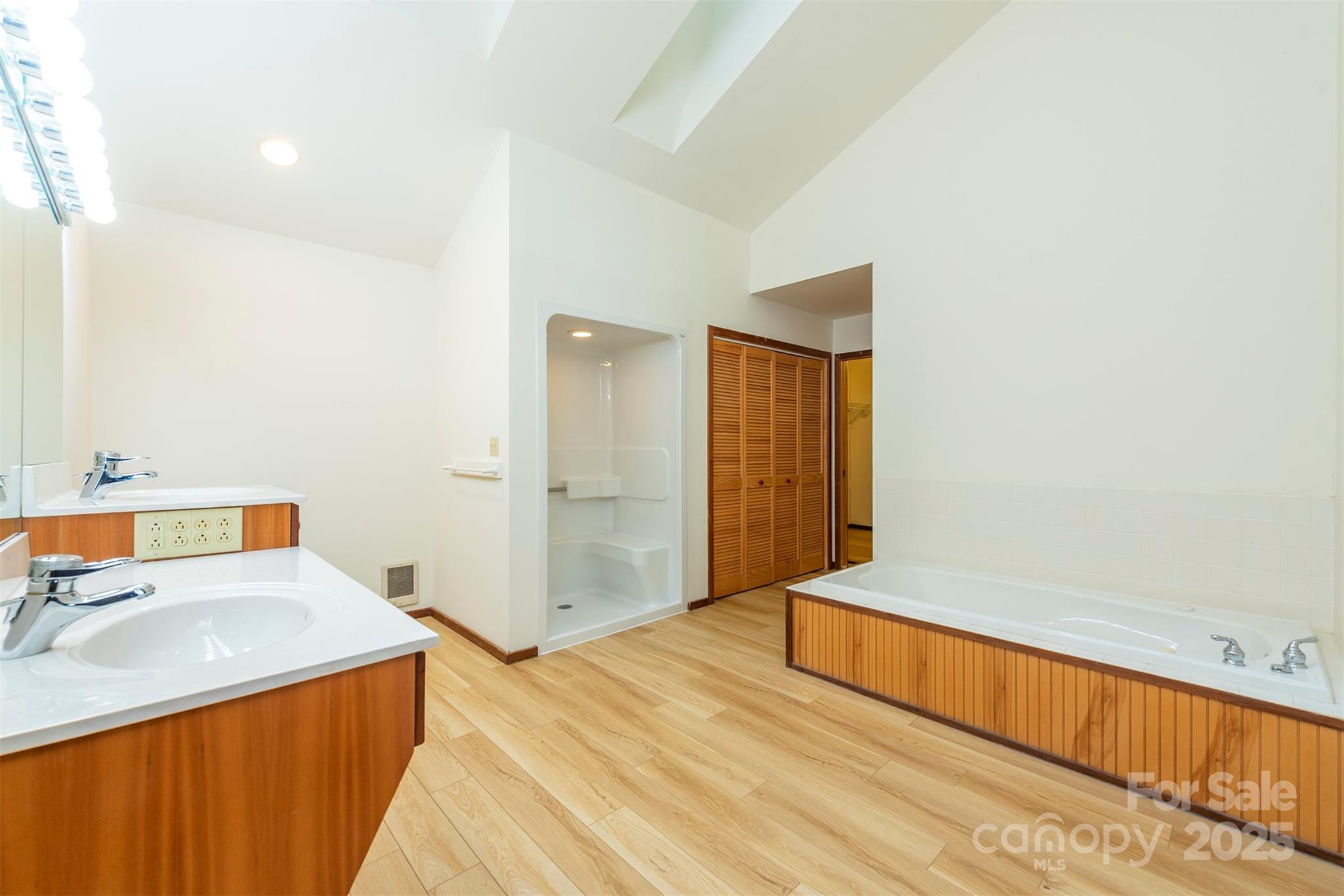 7 Winding Poplar Road Black Mountain, NC 28711 - Photo 21 of 48 a spacious bedroom with a bed and a sink