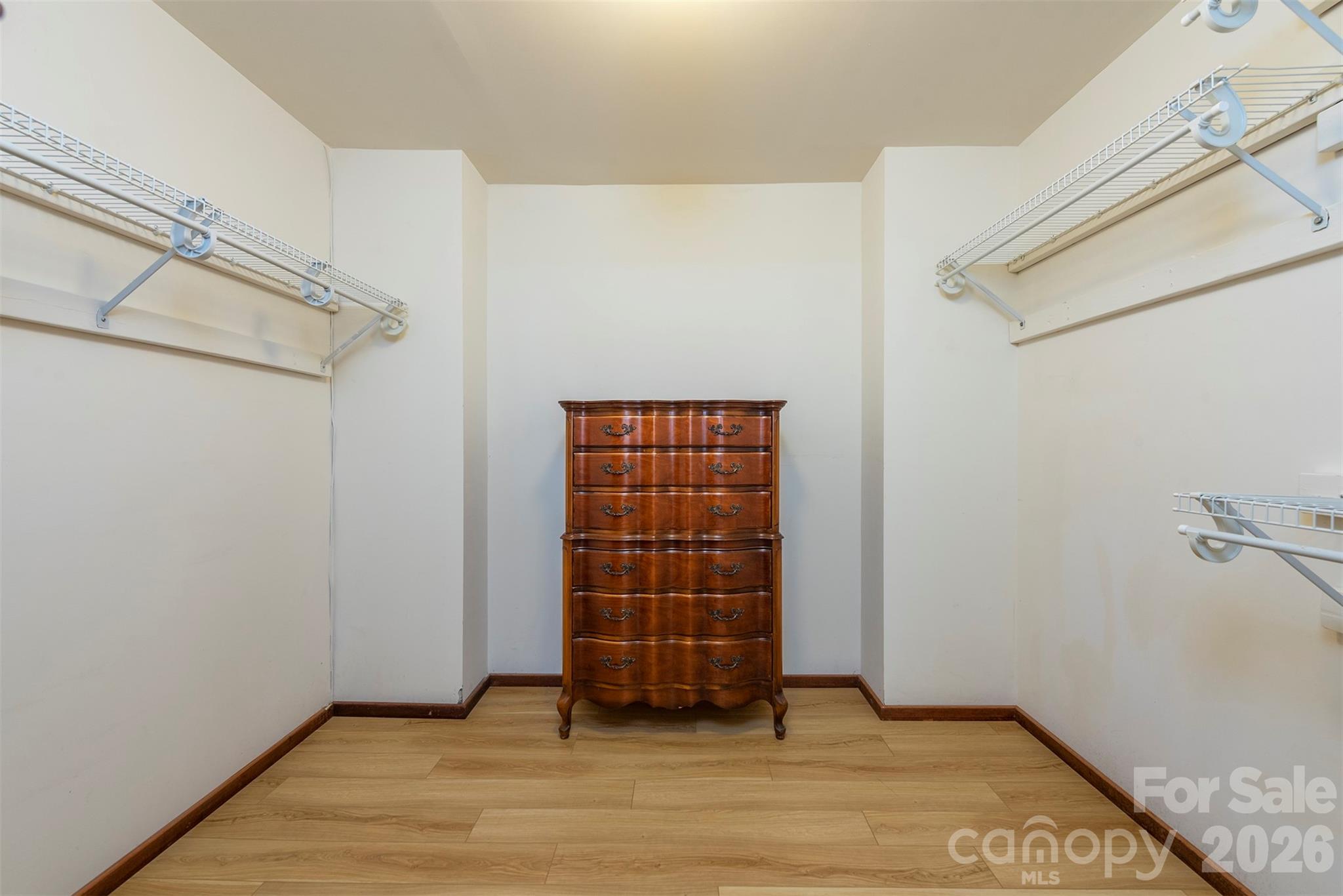 7 Winding Poplar Road Black Mountain, NC 28711 - Photo 23 of 48 a view of an empty room with wooden floor and cabinet