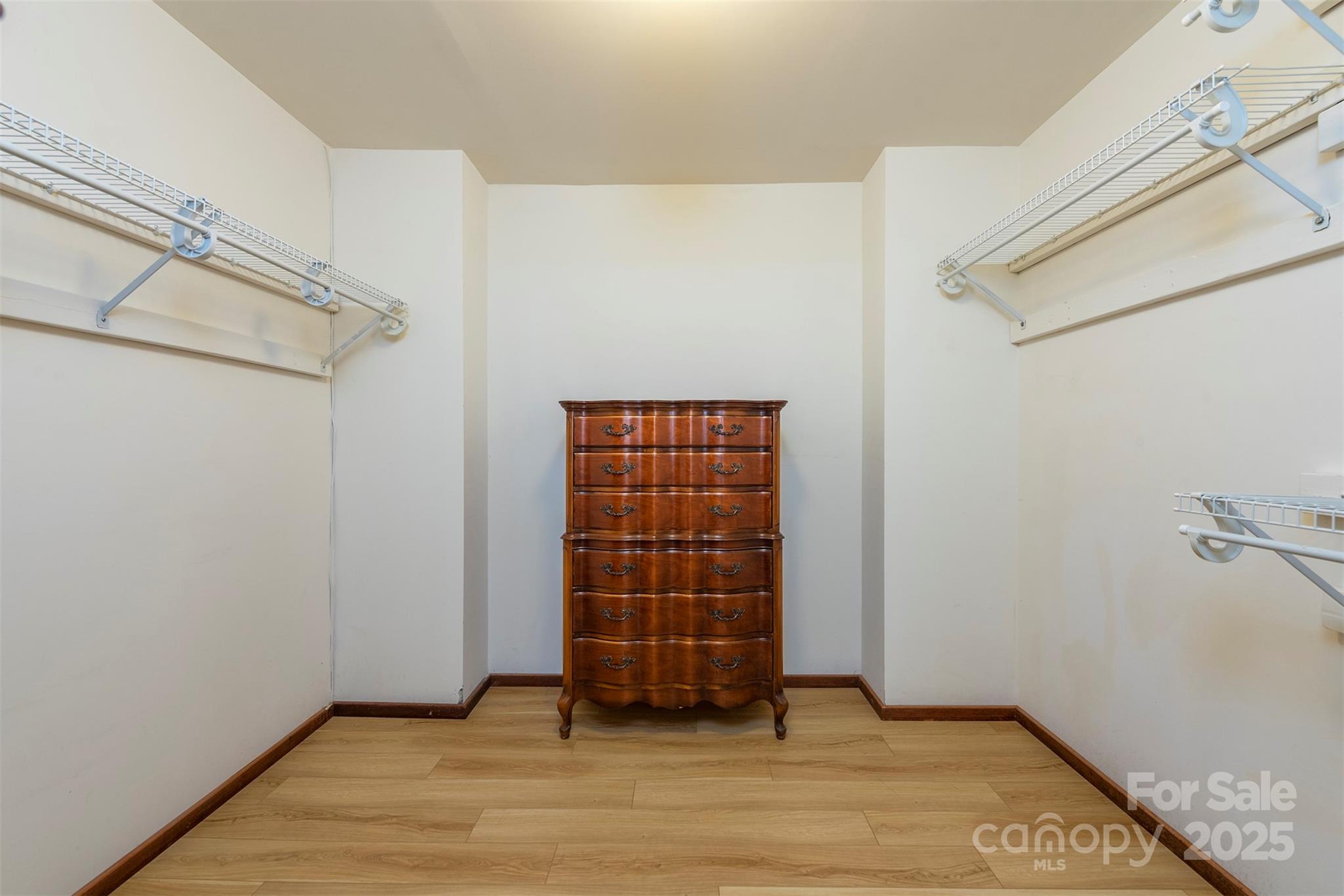 7 Winding Poplar Road Black Mountain, NC 28711 - Photo 24 of 48 a view of an empty room with wooden floor and cabinet