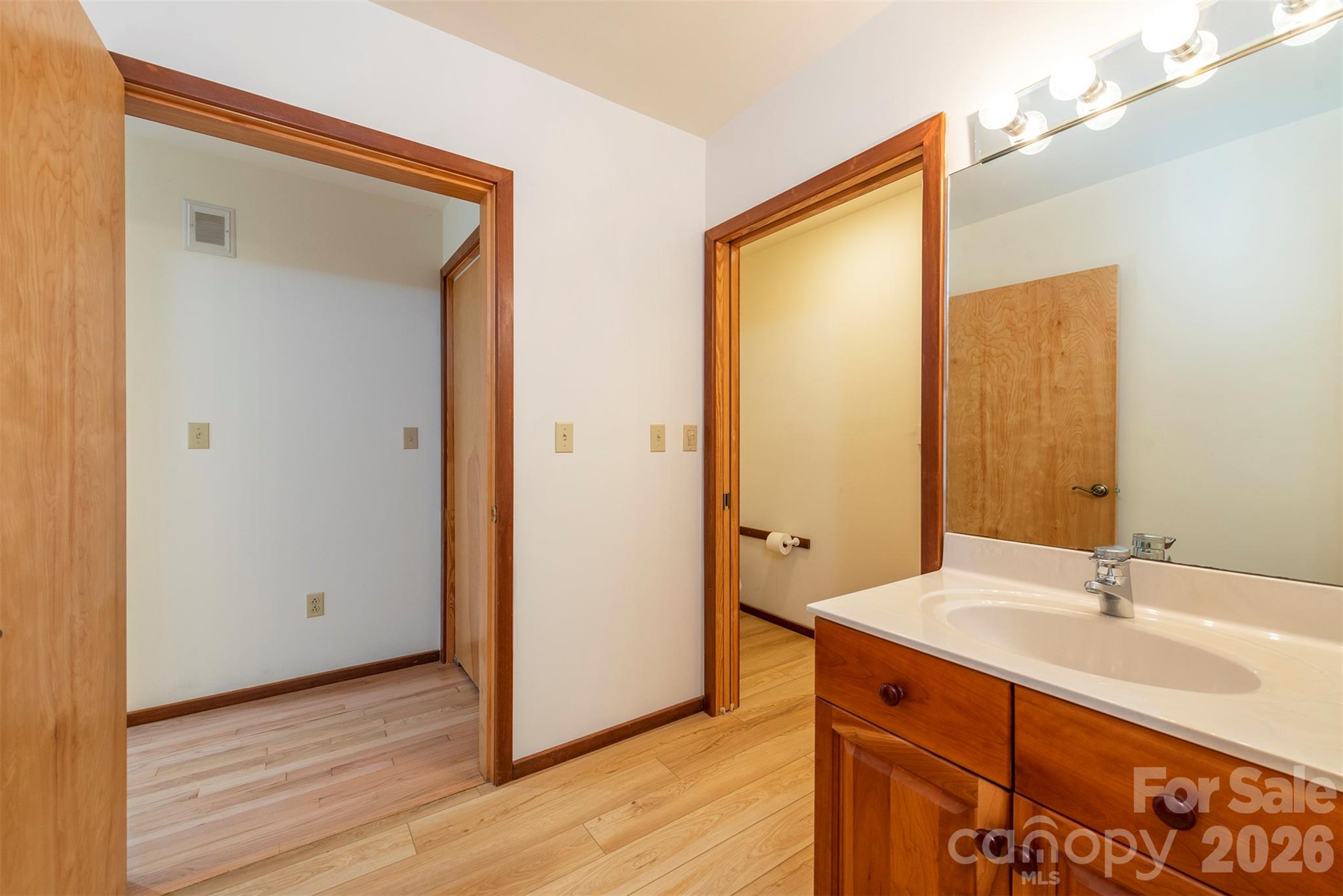 7 Winding Poplar Road Black Mountain, NC 28711 - Photo 25 of 48 a bathroom with a sink and a mirror