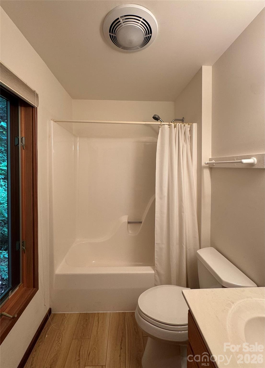 7 Winding Poplar Road Black Mountain, NC 28711 - Photo 32 of 48 a bathroom with a sink a toilet a window and shower