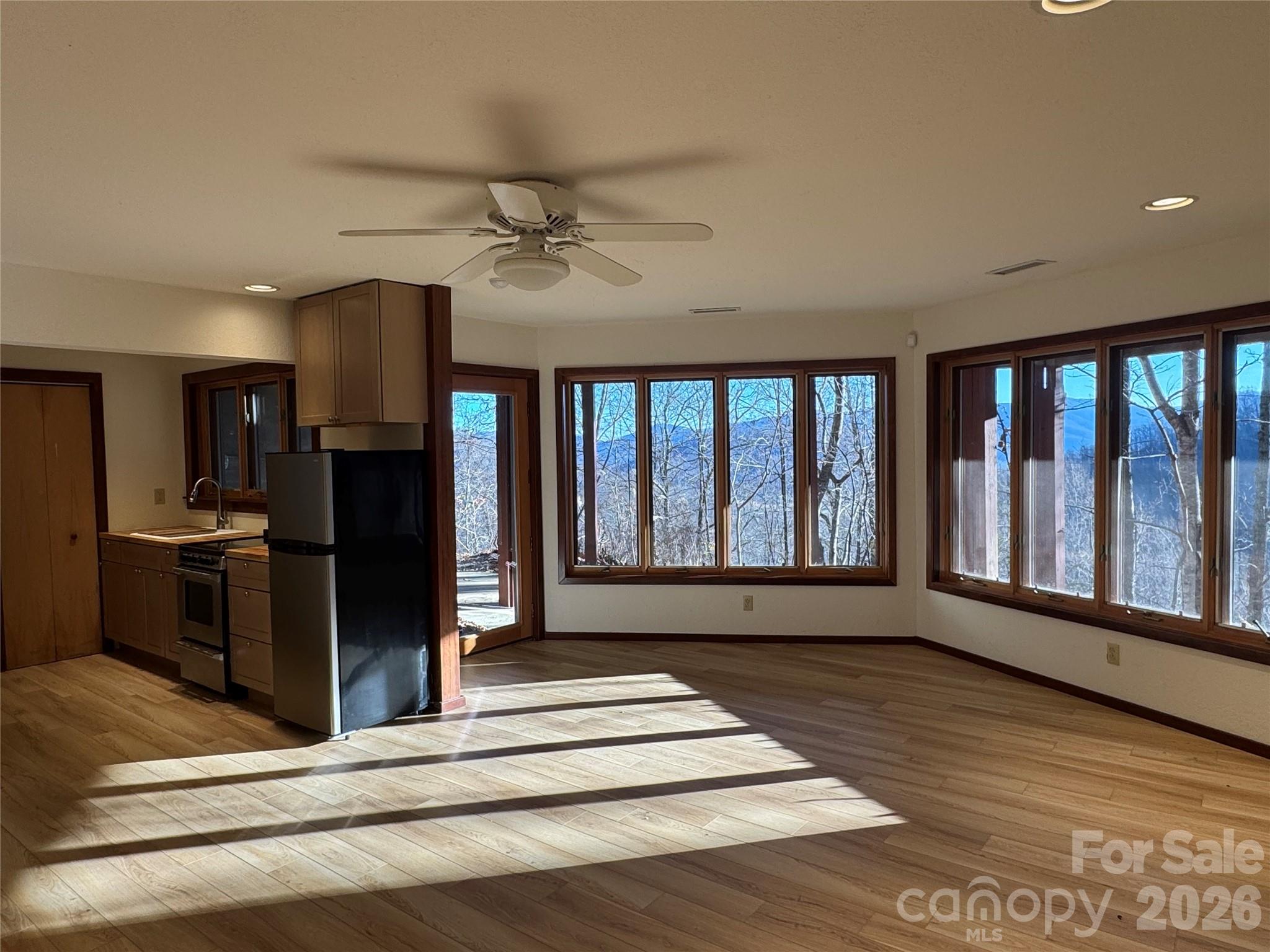 7 Winding Poplar Road Black Mountain, NC 28711 - Photo 34 of 48 a view of a living room with a fireplace and a large window