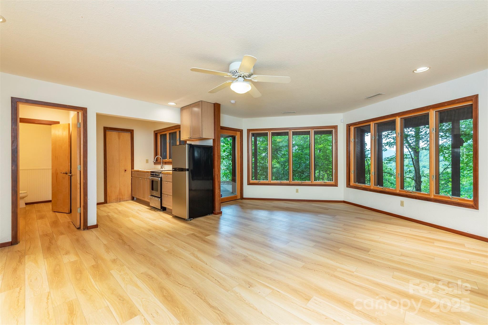 7 Winding Poplar Road Black Mountain, NC 28711 - Photo 35 of 48 a view of an empty room with window and wooden floor