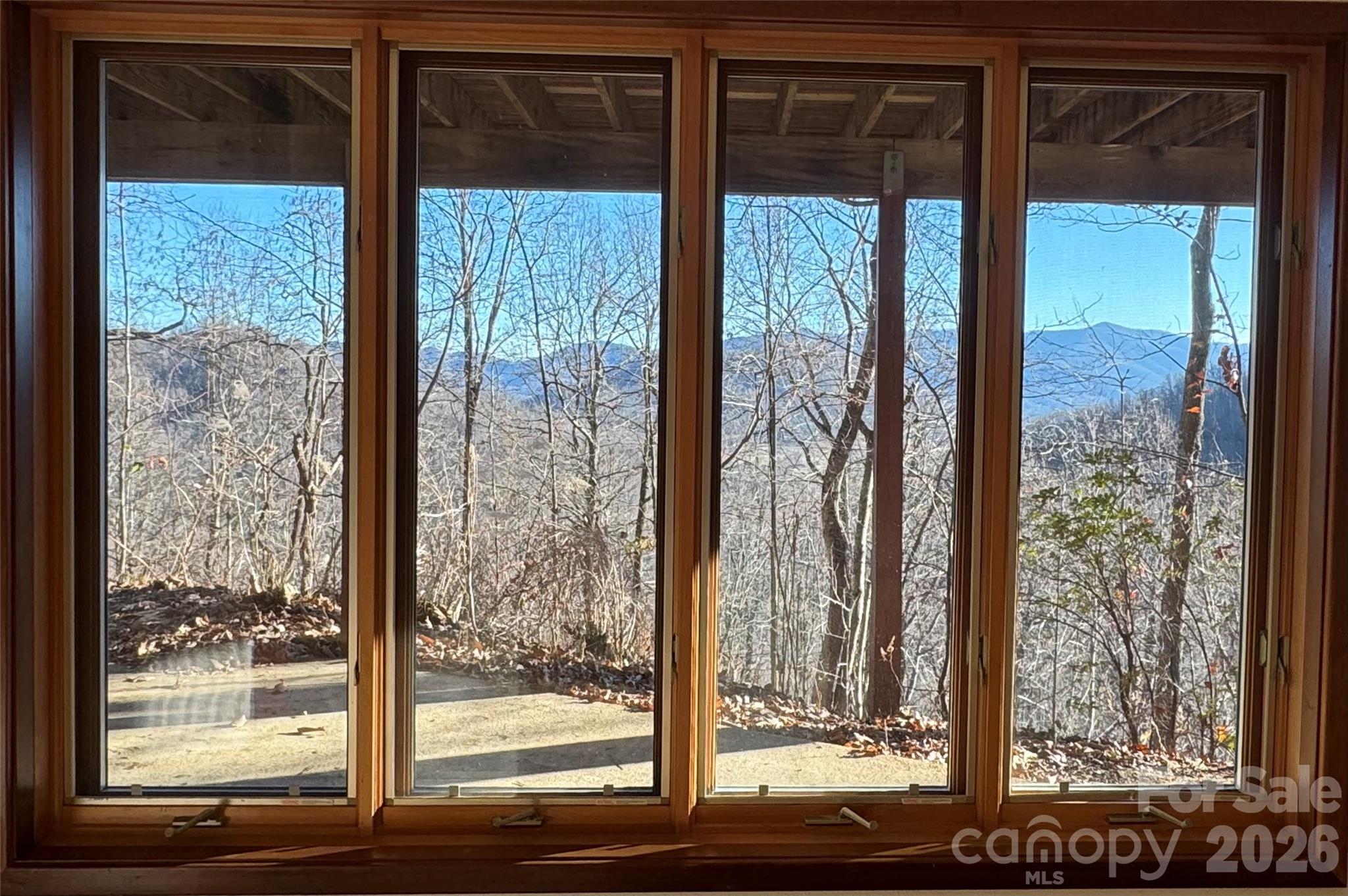 7 Winding Poplar Road Black Mountain, NC 28711 - Photo 36 of 48 a view of a room with a large window and wooden floor