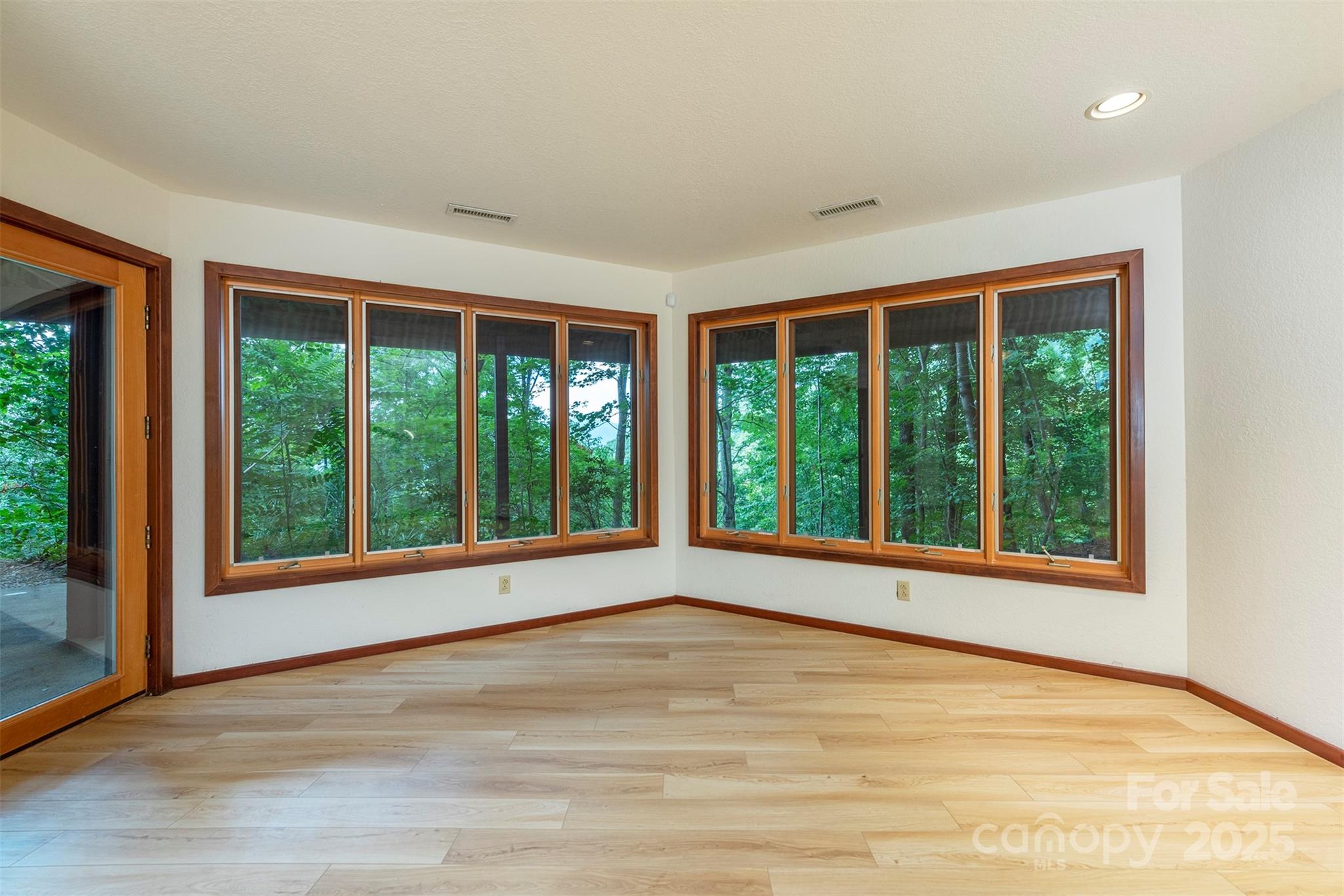 7 Winding Poplar Road Black Mountain, NC 28711 - Photo 36 of 48 a view of an empty room with wooden floor and a window