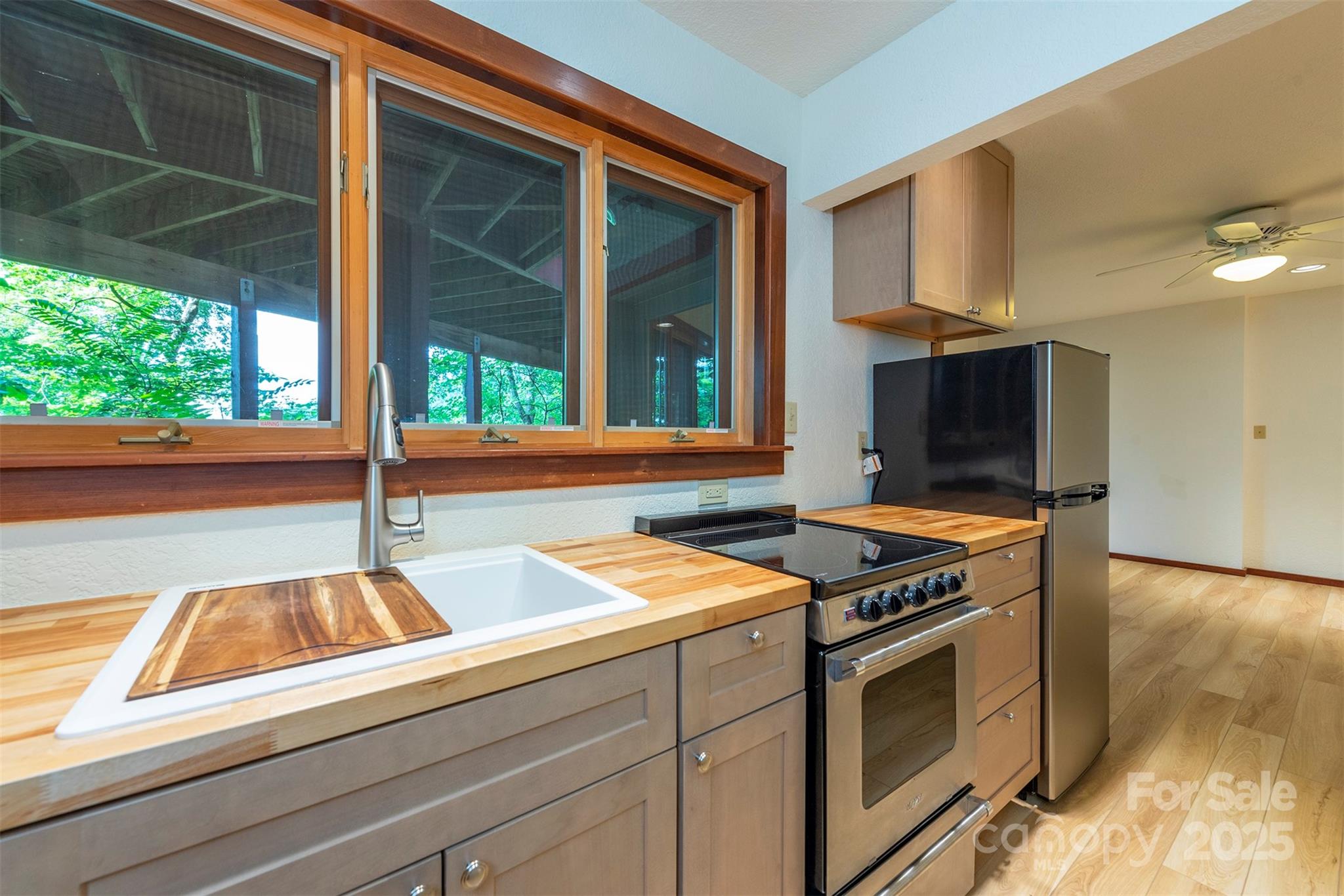 7 Winding Poplar Road Black Mountain, NC 28711 - Photo 37 of 48 a kitchen that has a sink and a stove
