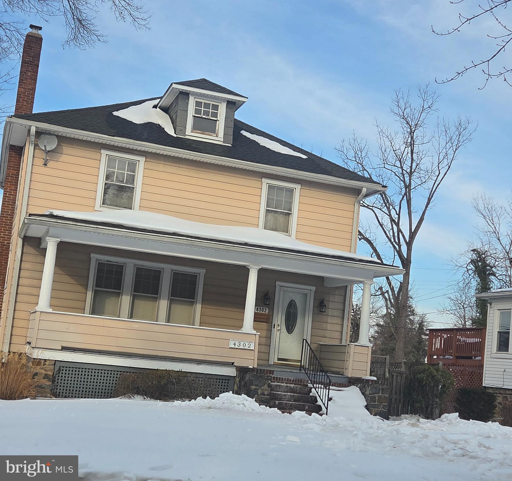 4302 Carleview Road Baltimore, MD 21207 - Photo 3 of 11 a front view of a house with a large tree