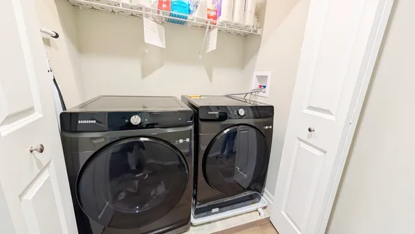 a utility room with dryer and washer