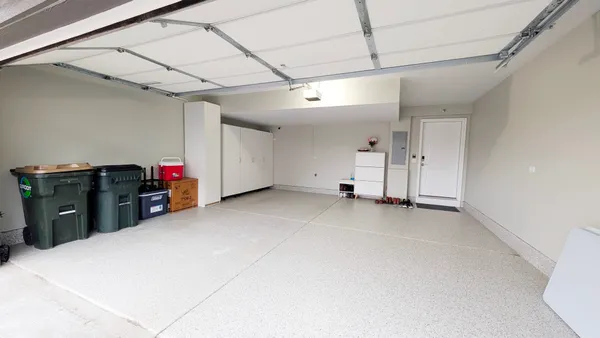 a view of a storage & utility room with two washing machine
