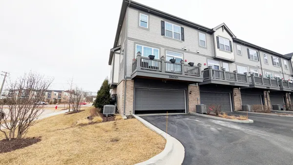 a view of a building with a snow on the road