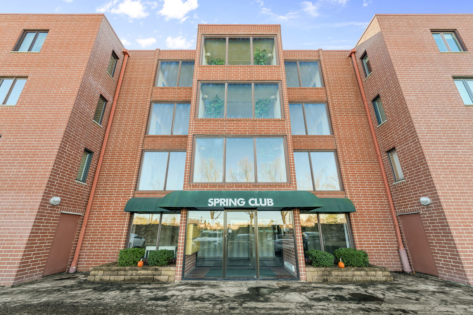 1S095 Spring Road, Unit 1D Oakbrook Terrace, IL 60181 - Photo 1 of 26 a front view of a multi story residential apartment building
