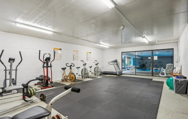 1S095 Spring Road, Unit 1D Oakbrook Terrace, IL 60181 - Photo 23 of 26 a view of a room with gym equipment