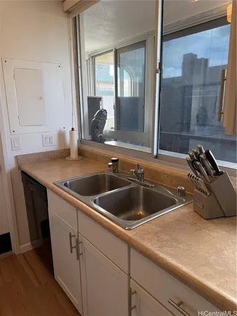 a view white cabinets and sink