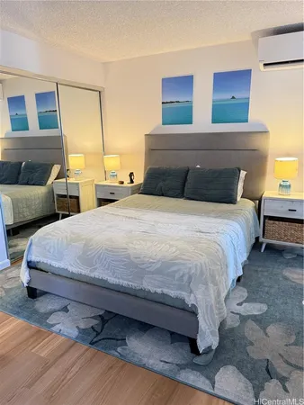 a bedroom with a bed and a couch