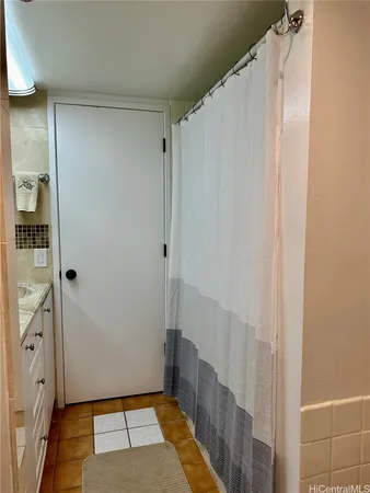 a view of walk in closet with wooden floor