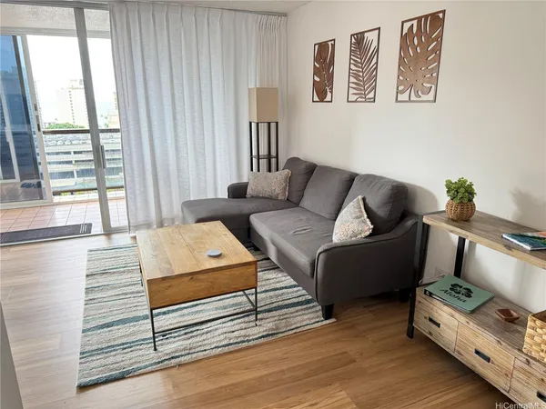 a living room with furniture and a window