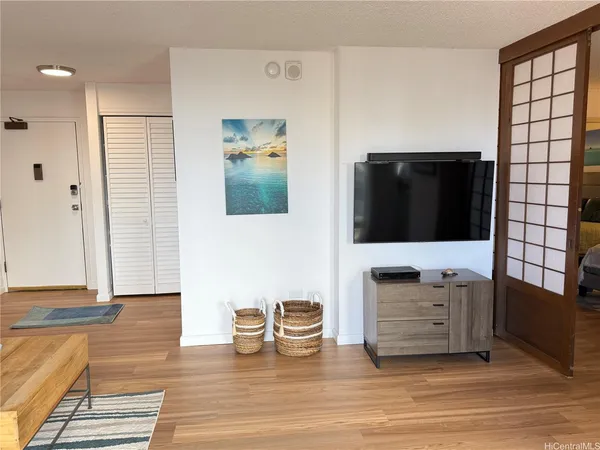 a view of living room with furniture and flat screen tv