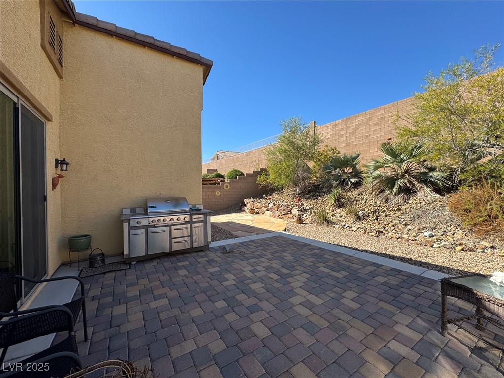 2128 Delmar Farms Court Laughlin, NV 89029 - Photo 35 of 36 Fenced backyard with a patio