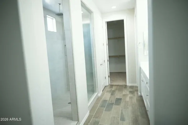 a view of a bathroom from a hallway