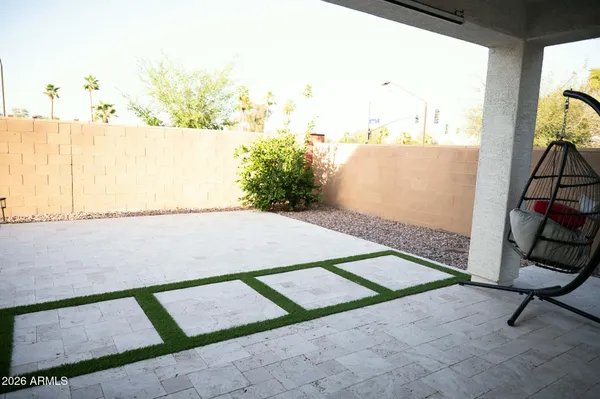 a view of a yard with large trees