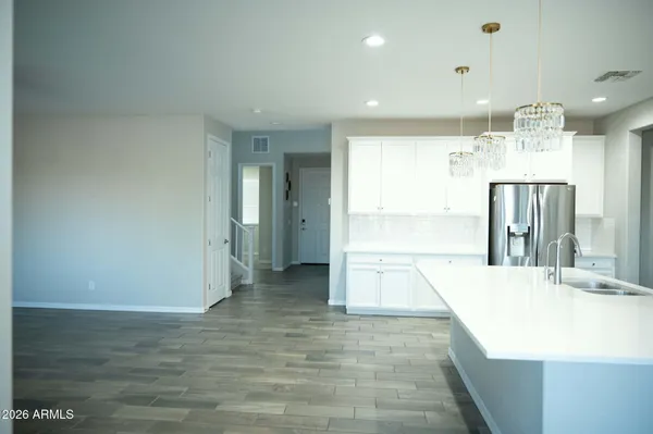 a view of a kitchen with a sink and cabinets