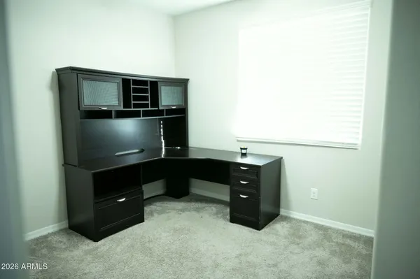a room with cabinets and flat screen