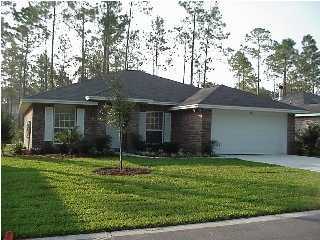 266 Rivercrest Circle Santa Rosa Beach, FL 32459 - Photo 1 of 1 a view of a house with a yard and a large tree