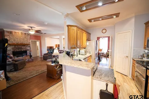 a view of a living room and kitchen view