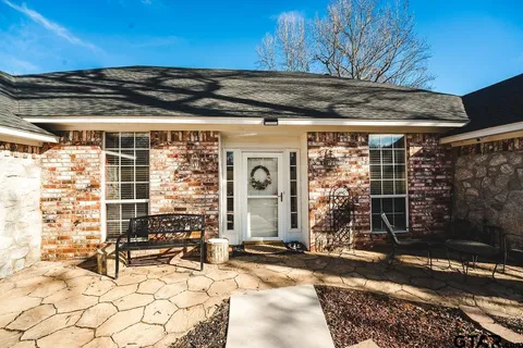 a front view of a house with large windows