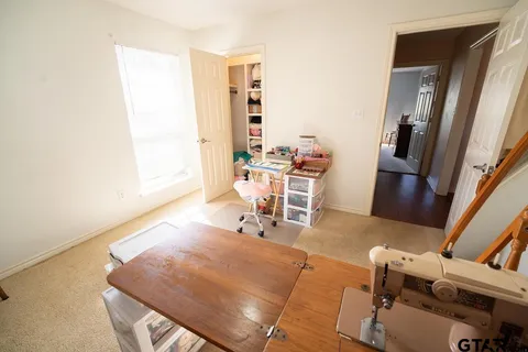 a room with furniture and wooden floor