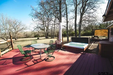 a view of a chairs and table on the wooden floor