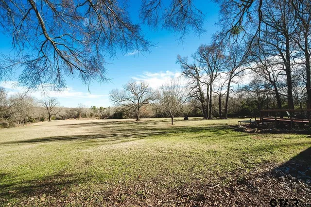 a view of a swimming pool with an outdoor space and seating area