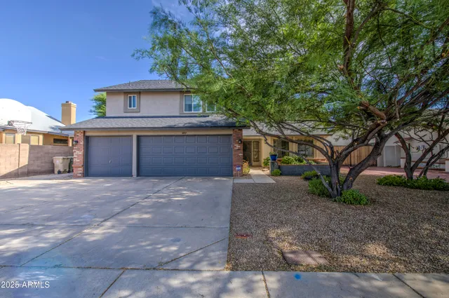 a view of a house with a street